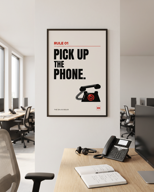 Pick Up the Phone sales poster, Rule 01, in a wooden frame in a black finish on a sales office wall
